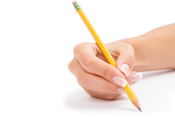 a pencil in a hand is isolated on a white background