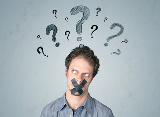 Young man with glued mouth and question mark symbols