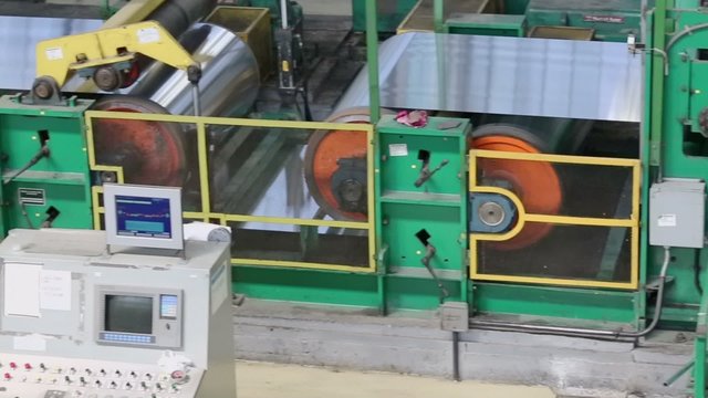 Aluminum is processed in machine of rolling mill