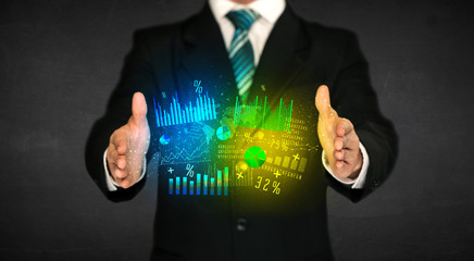 Businessman holding diagram cloud