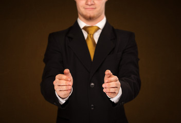 Businessman holding something