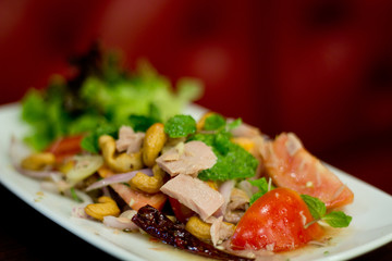 Thai spicy tuna salad with onion and tomato