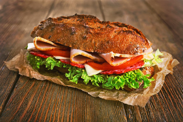 Fresh and tasty sandwich with ham and vegetables