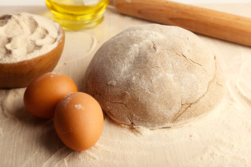 Making bread on wooden table background