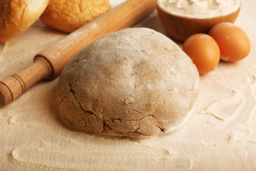 Making bread on wooden table background
