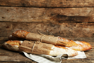Fresh bread on old wooden table