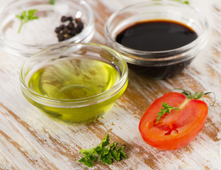 Bowl of Balsamic vinegar and olive oil on a wooden table