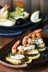 Appetizer canape with shrimp and lemon