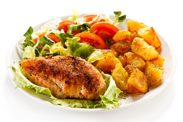 Fried chicken fillet, boiled potatoes and vegetable salad