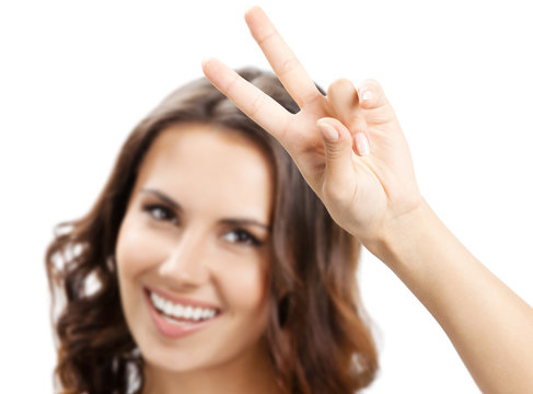 Woman showing two fingers or victory gesture, on white