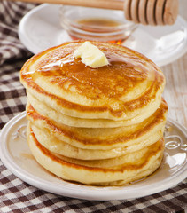 Stack of Small pancakes with maple syrup
