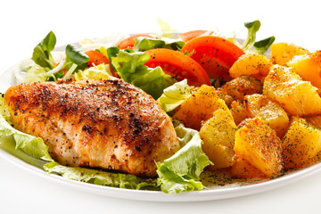Fried chicken fillet, boiled potatoes and vegetable salad
