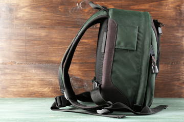 Backpack on wooden background