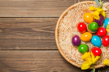 Easter nest with eggs and flowers