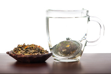 Aromatic antioxidant green tea on wooden board, isolated backgro