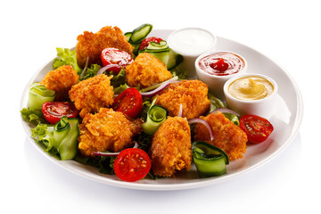 Fried chicken nuggets and vegetables