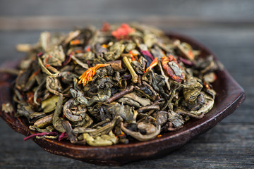 Aromatic antioxidant green tea on wooden board