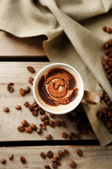 Cup of coffee on old wooden table
