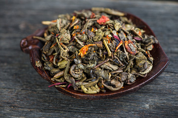 Aromatic antioxidant green tea on wooden board