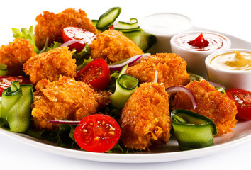 Fried chicken nuggets and vegetables