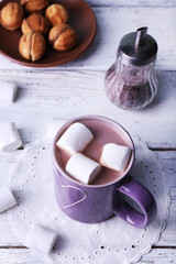 Cup of cocoa with marshmallows and cookies