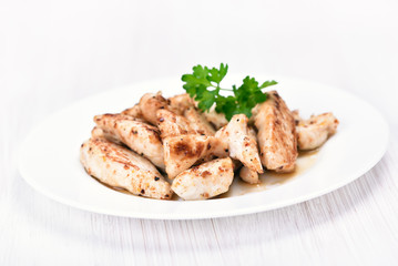 Chicken meat sliced on white plate