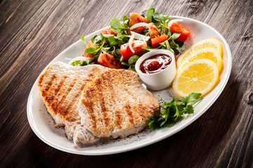 Grilled steaks and vegetable salad