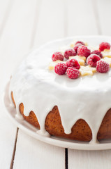Banana Cake with Sugar Glaze Topped with Raspberries and Banana