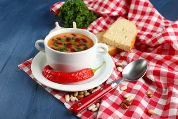 Bean soup in bowl with fresh sliced bread
