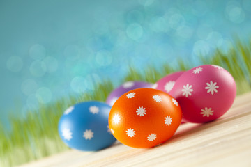 Fototapeta premium Colored Easter eggs on blue background