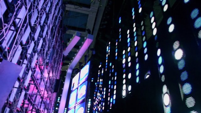 Radiators among wires and illumination lamps