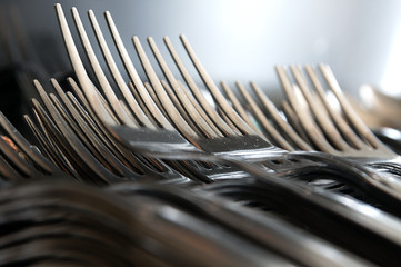 Forks arranged in series on the kitchen table.