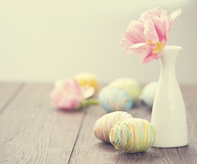 Easter photo decorated with colourful eggs and tulip flower