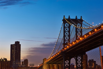 Manhattan Bridge and skyline view from Brooklyn at sunset