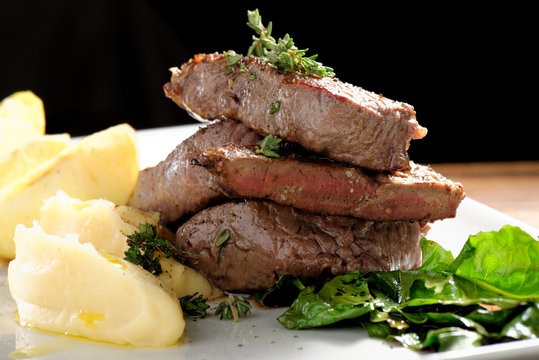 Venison meat steak with potato puree and vegetable