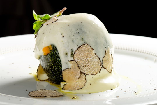 Fine dining, stuffed green pumkin with goat cheese and truffles