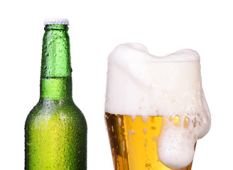 Isolated bottle with beer and glass with foam beer