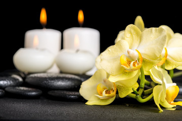 beautiful spa background of yellow orchid phalaenopsis and candl