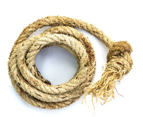 Hemp three strand rope coiled in a circluar pattern isolated aga