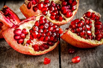 ruby pomegranate grains closeup on a table