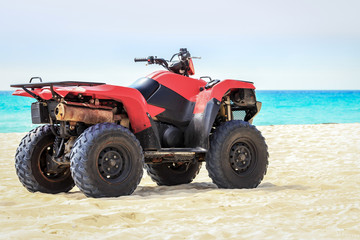 Fototapeta na wymiar Quad vehicle on the beach