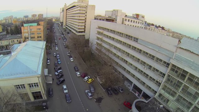 Cityscape with cars ride by street near typography 