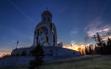Photo of the church against the setting sun.