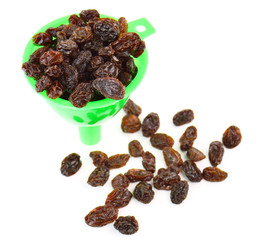 Dried raisins on a white background