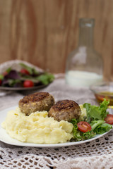 Meatballs cutlets with mashed potatoes and salad