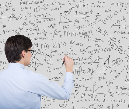 businessman drawing formulas