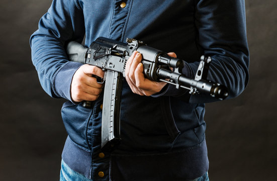 terrorist holding kalashnikov rifle