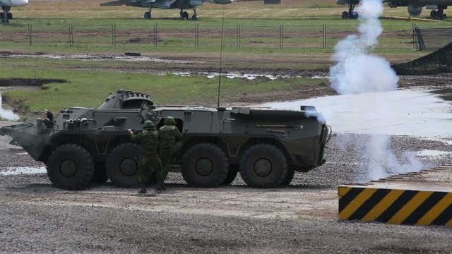 Soldiers get into BTR-80 during demonstration program