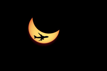 solar Eclipse and flying against the plane - 80206309