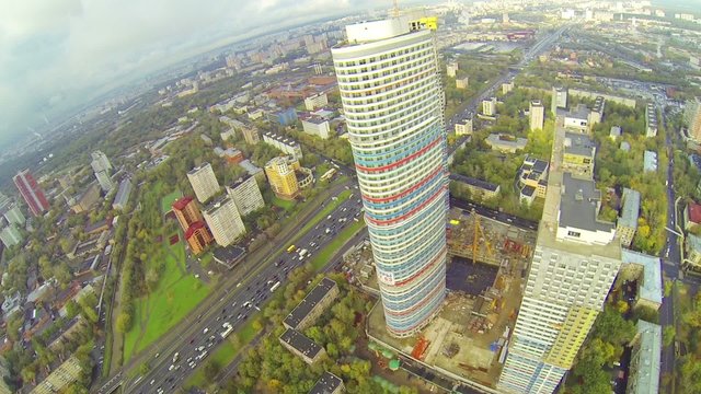 Day view: modern city with residential compound in construction